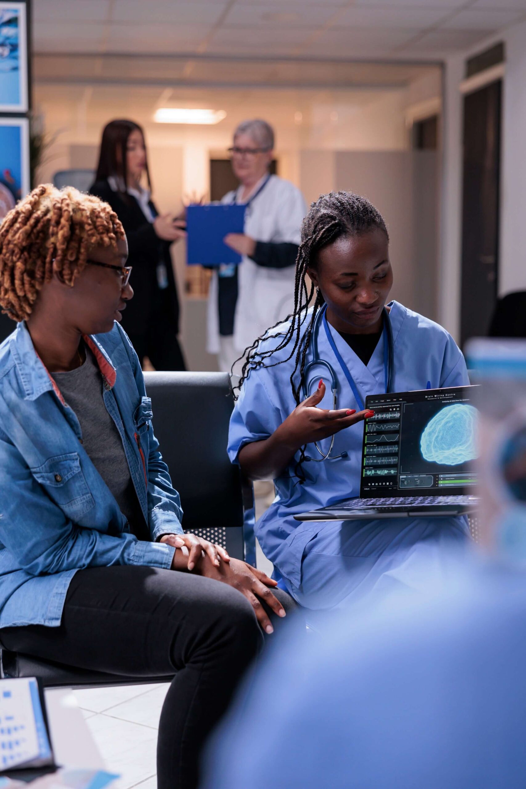 nurse-and-patient-analyzing-brain-scan-2023-11-27-05-15-23-utc